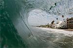 Close up surface level view of rolling wave and beach, Laguna Beach, California, USA