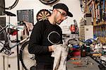 Technician in bicycle workshop