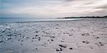 Rocks on tranquil gray beach, Vigsoe, Denmark