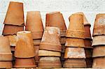Close up of stacks of terracotta plant pots.