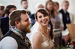 Smiling bride and groom at their church wedding.