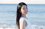 Young Japanese woman in a white dress by the sea, Chiba, Japan