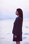 Young Japanese woman in a high school uniform by the sea, Chiba, Japan