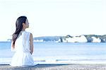 Young Japanese woman in a white dress by the sea, Chiba, Japan