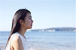 Young Japanese woman in a white dress by the sea, Chiba, Japan