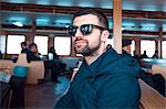 Portrait of man on ferry wearing sunglasses, Istanbul, Turkey