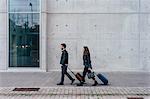 Couple with luggage, Florence, Italy