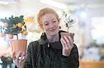 Florist working with potted plants