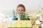 Florist working with potted plants