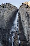 Towering rock face waterfall, Yosemite National Park, California, USA