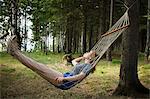 Woman resting in hammock, Nizny Tagil, Russia