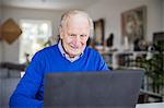 Senior man using laptop