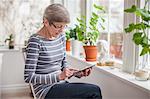 Senior woman using digital tablet