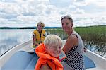 Mother with children on boat