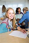 Smiling girl sitting at desk