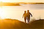 Children walking at sunset