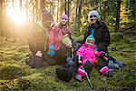 Happy family in forest