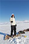 Young woman ice fishing