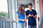 Teenagers using cell phone