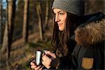 Young woman relaxing in forest