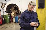 Mechanic using mobile phone