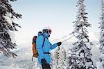 Skier taking selfie on snowy mountain