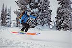 Skier skiing on snowy mountains