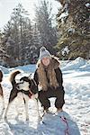 Woman petting Siberian dog