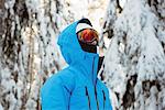 Skier looking at snow covered mountains