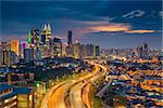 Cityscape image of Kuala Lumpur, Malaysia during sunset.