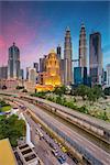 Cityscape image of Kuala Lumpur, Malaysia during twilight blue hour.