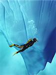 Diver swimming near an iceberg. This is a 3d render illustration.