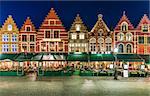 Market Square in Bruges Belgium evening landscape panorama with summery of restaurant and ancient architecture medieval town.