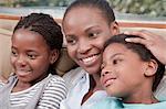 Mother and children happily sitting together, Illovo Family, Johannesburg, South Africa.