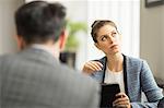 Businessman and woman in office meeting