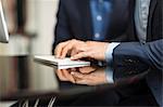 Detail of businessman's hands typing on desktop computer keyboard