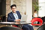 Portrait of businessman at office desk