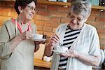 Senior adult women drinking coffee together
