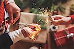 Couple holding indoor sparklers