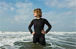 Girl standing in the North Sea wearing wetsuit