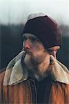 Double exposure portrait of bearded young male hipster