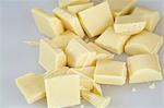 Close up high angle view of pieces of white chocolate.