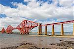 The famous Forth Bridge over Firth of Forth at low tide at South Queensferry in Edinburgh, Scotland, United Kingdom