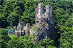 The medieval Rheinstein Castle on the cliffs along the Rhine between Rudesheim and Koblenzat at Trechtingshausen, Germany