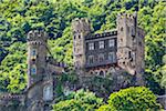 Close-up of the medieval Rheinstein Castle on the cliffs along the Rhine between Rudesheim and Koblenzat at Trechtingshausen, Germany