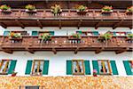 Traditional architecture with wooden balconies, shutterd windows and flowerboxes in the town of Mittenwald in Bavaria, Germany