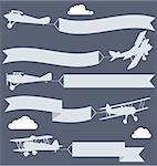 Silhouettes of biplanes with wavy greetings banner