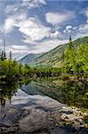 Siberia. Beautiful green fog lake in the forest. Buryatia. Autumn