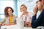 Digital design team discussing ideas  at conference table