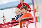 Three generation family on sailing boat, Geneva, Switzerland, Europe